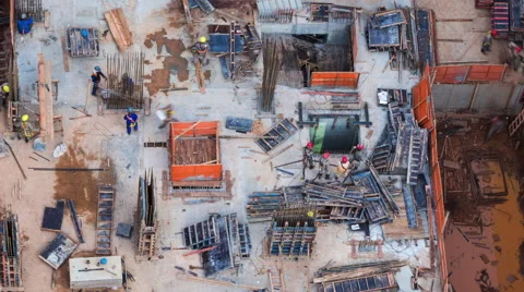 Timelapse View of Men Working at Construction Site Seen from Above - Zoom Out Stock Footage