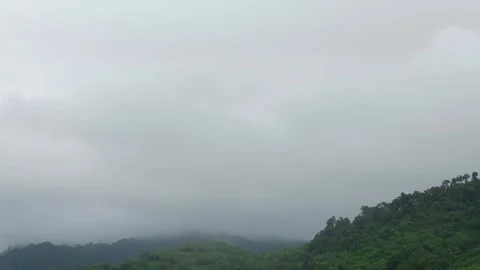 Timelapse view of mountain range with mist moisture cloud in sunset time da.. Stock Footage 252573732