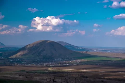 Timelapse with a view of the mountains and clouds moving across the sky Stock Footage 274994020