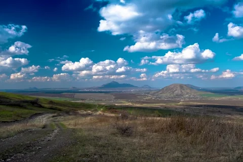 Timelapse with a view of the mountains and clouds moving across the sky Stock Footage 274994035