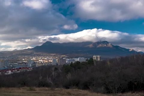 Timelapse with a view of the mountains and clouds moving across the sky Stock Footage 274994294