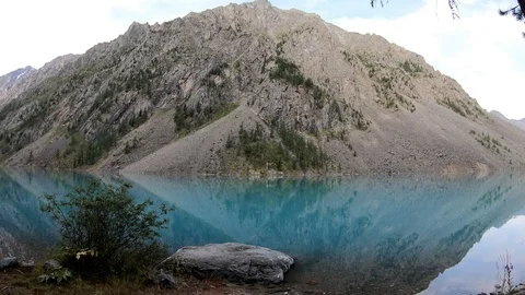 Timelapse view of the mountains and the lake in the morning. Stock Footage 119369394