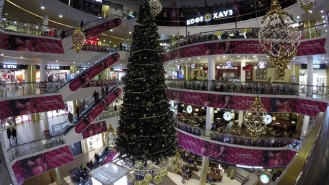 Timelapse View: People are doing shopping in Christmas decorated shopping mall Stock Footage 70653924