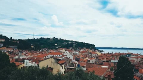 TImelapse View of the Red Tiled Roofs of Houses on Cloudy Day in Piran Slovenia Video stock 250293315