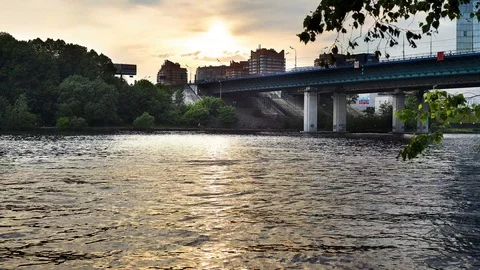 Timelapse, view of the river with a bridge, golden light Stock Footage 122706510