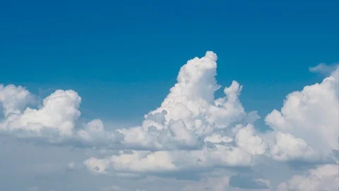 Timelapse view of rolling clouds in blue sky Stock Footage 108281059