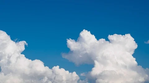 Timelapse view of rolling clouds in blue sky. Stock Footage 112669971