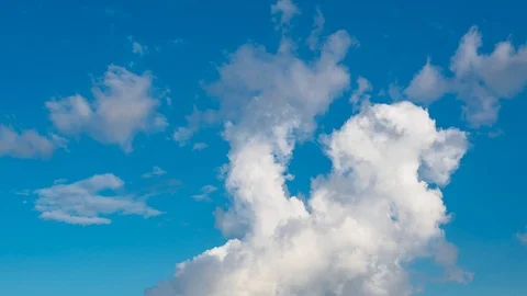 Timelapse view of rolling clouds in blue sky. Stock Footage 112670005