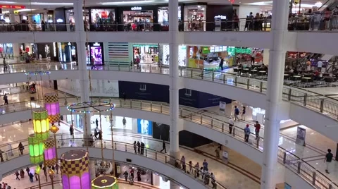 Timelapse view of shoppers in Suria KLCC Mall interior Stock Footage 64624115