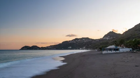 Timelapse view of a sunset on the beach in Taormina, Sicily Stock Footage 121560769