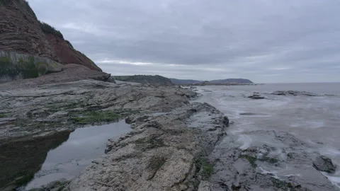Timelapse view of the tide coming in over coastal rocks Stock Footage 167218158