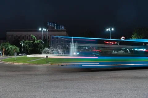 Timelapse view of the traffic on the square around the fountain. Stock Photos