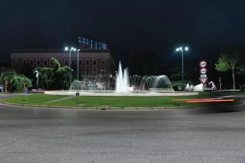 Timelapse view of the traffic on the square around the fountain. Stock Photos