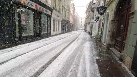 Timelapse walking pov through heavy snow in Ljubljana city center Stock Footage 153291144