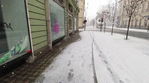Timelapse walking pov through heavy snow in Ljubljana city center Stock Footage 153292705