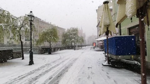 Timelapse walking pov through heavy snow in Ljubljana city center Stock Footage 153295064