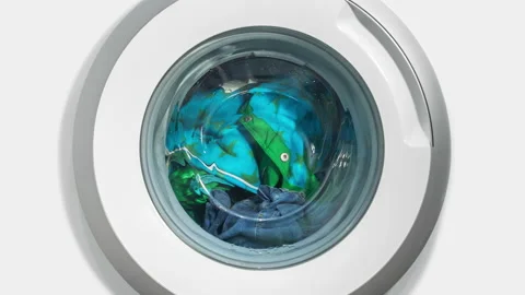 Timelapse washing machine, laundry machine wash clothes motion blur round drum Stock Footage 170854574