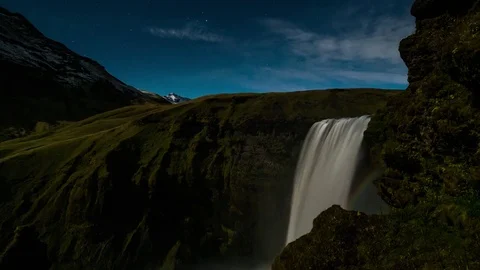 Timelapse of waterfall and moonbow over the green hill Stock Footage 73011445