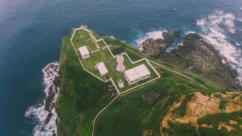Timelapse of the waves breaking in cliff. Blue sea under lighthouse Stock Footage 104079975
