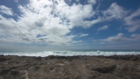 Timelapse of Waves Rolling in Behind Volcanic Rock in Hawaii Stock Footage 104433098