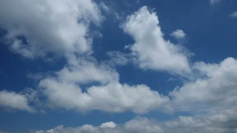 Timelapse of wavy white clouds during the day Stock Footage 272477441