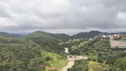 Timelapse of Weather Changes in the Mountains Sun and Light Rain Alternating 動画素材 313879686
