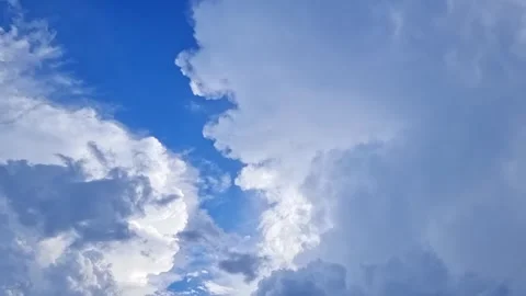 Timelapse white and gray clouds move across the sky in an abstract manner w.. Stock Footage 300075170