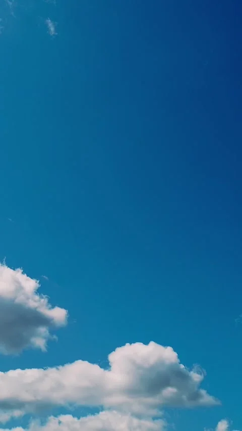 Timelapse, white, beautiful clouds are running against the blue sky. Stock Footage 321754192