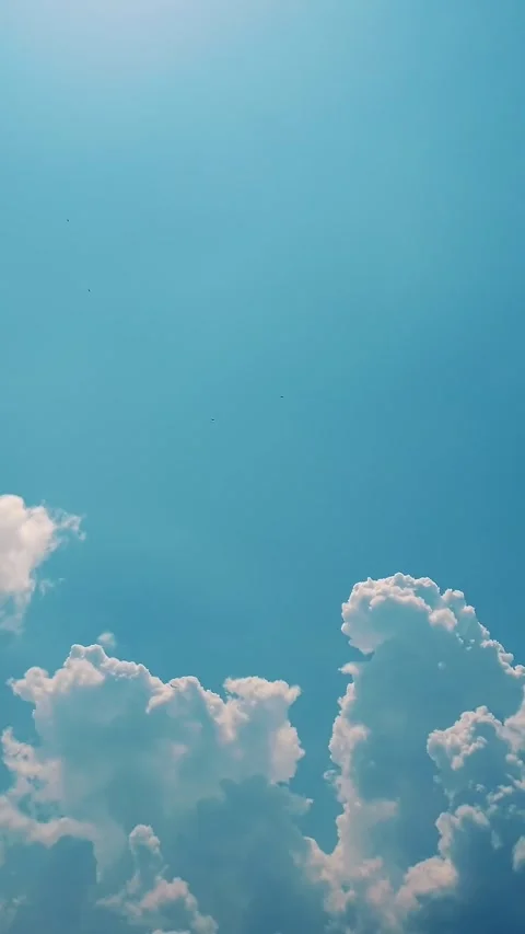Timelapse, white, beautiful clouds are running against the blue sky. Stock Footage 322115320