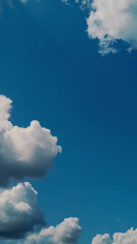 Timelapse, white, beautiful clouds are running against the blue sky. Stock Footage 323288156