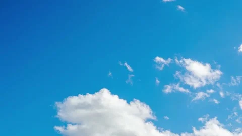 Timelapse of white clouds against a blue sky Stock Footage 144737692