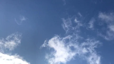 Timelapse of white clouds on a blue sky. Stock Footage 80353207
