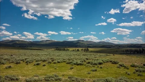 Timelapse of white clouds crossing Bunsen Peak Trial in Yellowstone National Par Stock Footage 268716074