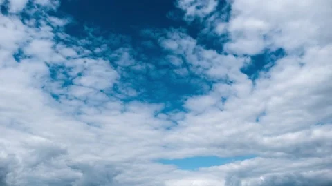 Timelapse of White Clouds Drifting Across a Deep Blue Sky Video stock 315227809