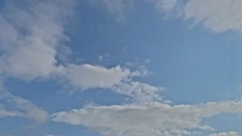 Timelapse, white clouds float across the blue sky Stock Footage 170534703
