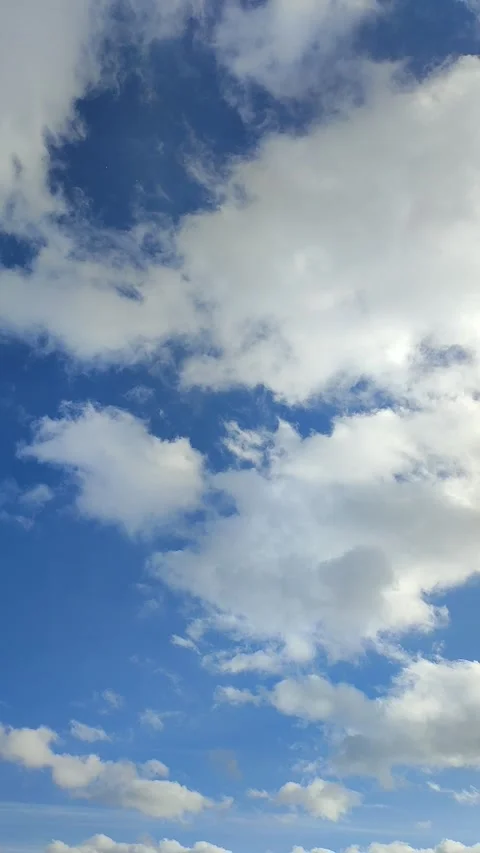 Timelapse of white clouds floating across the blue sky on sunny day Stock-Footage 235628554