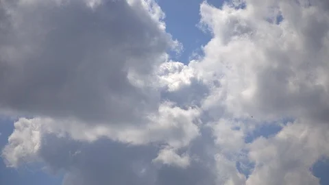 Timelapse white clouds move across the blue sky Stock Footage 113324000