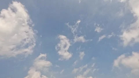 Timelapse of white clouds moving fast in the blue sky Stock Footage 320936296