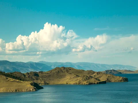 Timelapse. A white clouds moving over the shore of Lake Baikal Stock Footage 79942639