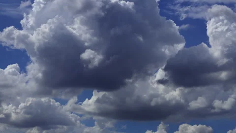 Timelapse of white clouds moving rapidly across a clear blue sky. Stock Footage 336904567