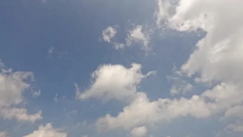 Timelapse of white clouds rolling in the blue sky Stock Footage 320936367