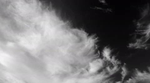 Timelapse of white clouds under dark gray sky. Cirrus and cirrostratus moving. Stock Footage 68343225