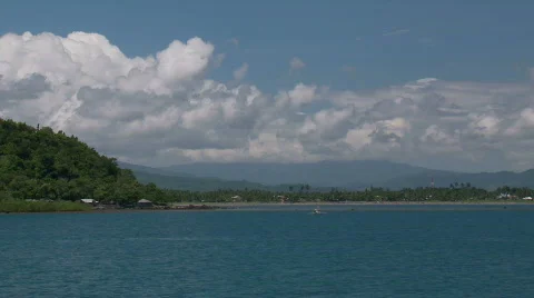 Timelapse of White Cumulus Clouds forming over tropical coast Video stock 557103