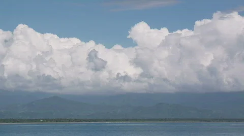 Timelapse of White Cumulus Clouds over coast Stock-Footage 559234