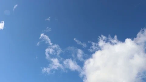 Timelapse of White Cumulus Clouds Rolling Across Blue Sky Stock Footage 117958208