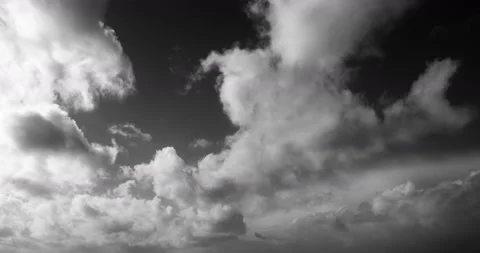 Timelapse of white cumulus obscuring the sky. Black and white 4K footage clip. Stock Footage 150563163