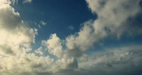 Timelapse of white cumulus obscuring the sky. Evening tones. 4K. Stock Footage 150564880