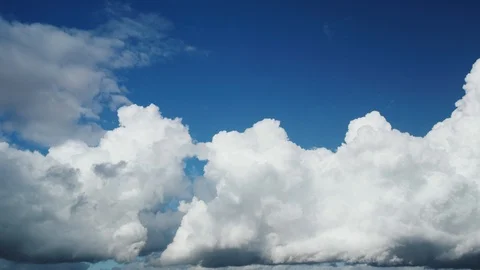 Timelapse of White Fluffy Clouds and Blue Sky in 4K Stock Footage 102459860