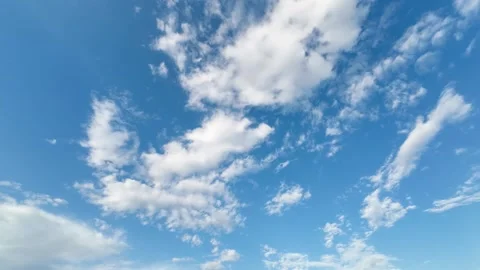 Timelapse - White fluffy clouds in the blue sky, sunny day Stock Footage 311312773