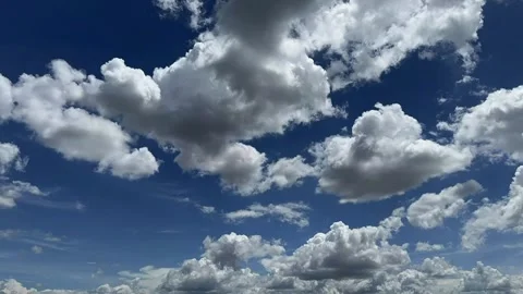 Timelapse White Fluffy Clouds Drifting Blue Sky  Tropical Thailand 4K Daytime Stock Footage 335699340